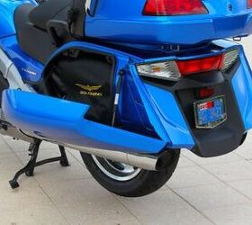 2012 honda gold wing review video motorcycle com, The Wing s rear end gets freshened up by stylish new saddlebags with extra capacity and a centrally mounted tail brake light flanked by clear lens turn indicators