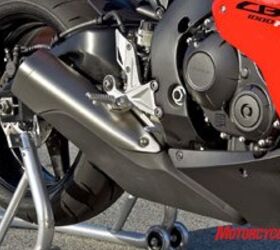 2008 honda cbr1000rr review motorcycle com, Honda abandoned the old CBR s Center Up undertail exhaust in favor of this bulky unit under and behind the engine It s the shape of things to come