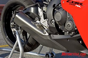 2008 honda cbr1000rr review motorcycle com, Honda abandoned the old CBR s Center Up undertail exhaust in favor of this bulky unit under and behind the engine It s the shape of things to come