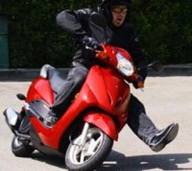 2010 honda elite review motorcycle com, Channeling Petey B I race foot forward toward my next card