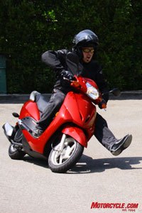 2010 honda elite review motorcycle com, Channeling Petey B I race foot forward toward my next card