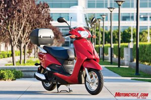 2010 honda elite review motorcycle com, The fully accessorized 2010 Elite is still an affordable package at just over 3 300 with 62 liters of carrying capacity plus the glove box For reference the 2009 Gold Wing s trunk holds 60 liters of gear
