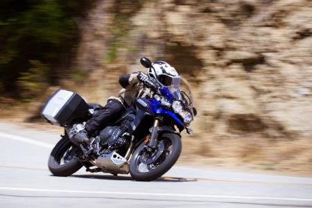 2012 triumph tiger explorer review motorcycle com, The Explorer s height and weight restrict its nimbleness when transitioning between tight canyon bends but once into its lean angle the Explorer corners confidently enough to scratch footpegs through the apex