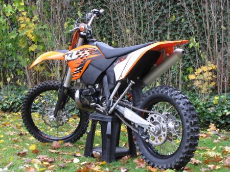 2010 ktm 300 xc w review motorcycle com, Less weight and complexity than a 250F with more torque off idle than a 450F It has great ergonomics as well making this a very easy bike to love
