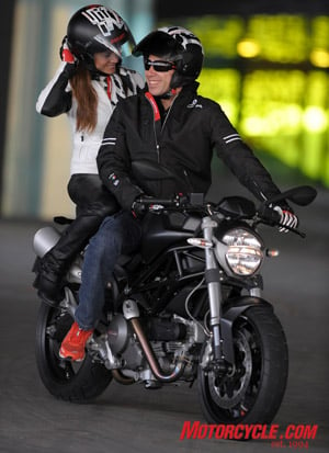 2009 ducati monster 696 review motorcycle com, You ll be smiling too if you re buzzin around on the new Monster 696 cause the ladies like em