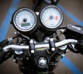 2013 moto guzzi v7 racer vs 2013 triumph thruxton video motorcycle com, while the Thruxton opens things up a bit with easy to read white faced VDOs