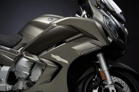 2013 yamaha fjr1300a preview motorcycle com, The dark section in the middle of the body panel is an adjustable wind deflector that also serves to redirect hot air from the engine bay moving the heat away from the rider s legs according to Yamaha