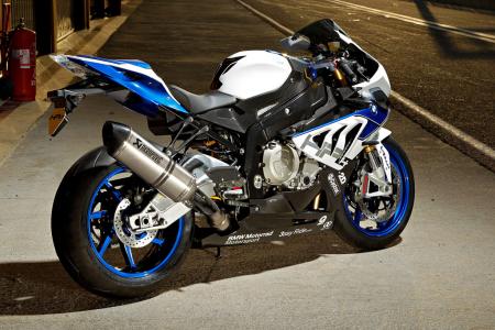 2013 bmw s1000rr hp4 review video motorcycle com, The HP4 elevates BMW s superbike game taking the potent S1000RR to a higher plane