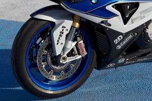 2013 bmw s1000rr hp4 review video motorcycle com, Monobloc Brembo calipers upgrade the braking system while forged aluminum wheels reduce rotating mass and hence steering effort