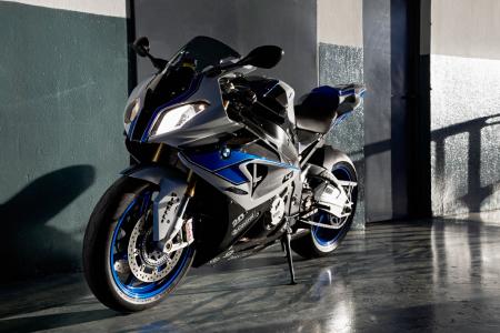 2013 bmw s1000rr hp4 review video motorcycle com, Blue wheels and the sponsor sticker kit identify an HP4 equipped with the Competition Package
