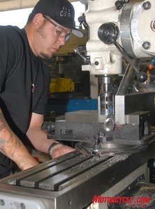 big bear choppers and the state of the production custom industry motorcycle com, Machining operations are performed with both CNC machines and manually operated machines Here a worker copes the end of a 0 250 inch wall thickness backbone tubing