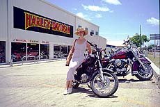 island chopping, Danielle sprucing up the parking lot This dealership was renting out Harley Davidson bikes for 65 day during the summer off season Expect to put up a hefty deposit on your plastic for the honor of riding American