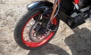 2011 zero electric motorcycles launch motorcycle com, Cross drilled Hayes stoppers work better than the binders on older Zeros The speedo pick up formerly residing on the fork has been relocated to the motor shaft to make it more like other motorcycles Askenazi says plus clean up the look