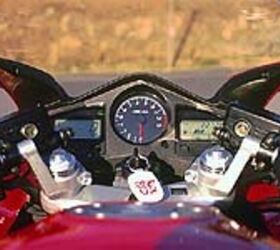 first ride 2002 honda vfr interceptor motorcycle com, The Interceptor s gauge cluster is about as informative and tidy as they come Center mounted tach hints at the machine s sporting nature