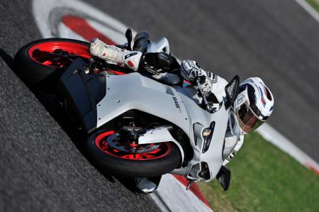 2011 ducati 848 evo review motorcycle com, The 848 EVO loves being leaned over in the corners