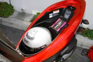 2013 honda pcx150 review motorcycle com, The 25 liter underseat storage can easily gobble up a full face helmet with room to spare