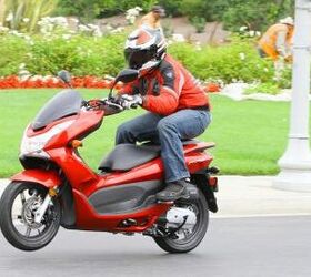 2013 honda pcx150 review motorcycle com, With enough motivation you can wheelie nearly anything