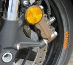 2010 honda cbr1000rr c abs review motorcycle com, They don t look any different than standard brake calipers but this pair of binders benefits from Honda s computer controlled Combined Anti lock Brake System