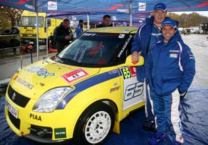capirossi third in rally race, Loris Capirossi front and co driver Craig Thorley stand next to their number 65 car while it s still clean