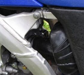 2010 yamaha yz250f review motorcycle com, The new frame and a lower spring position on the rear shock allowed engineers to design a new intake to boost low end response