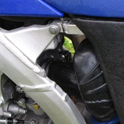 2010 yamaha yz250f review motorcycle com, The new frame and a lower spring position on the rear shock allowed engineers to design a new intake to boost low end response
