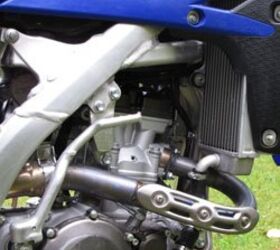 2010 yamaha yz250f review motorcycle com, The new YZ F has bigger radiators a new cylinder head and improved cylinder head access