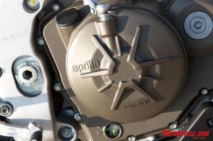 2010 aprilia rsv4 factory review motorcycle com, Magnesium engine covers are one of the many extras found on the RSV4 Factory when compared to the new more budget minded RSV4R