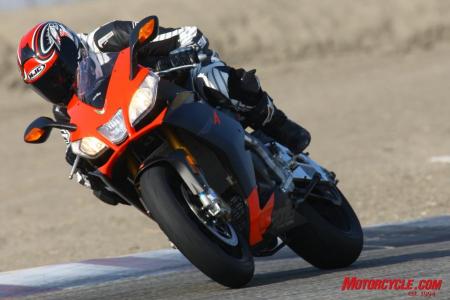 2010 aprilia rsv4 factory review motorcycle com, Hustling this literbike around the track is more akin to flicking a 600cc supersport between turns