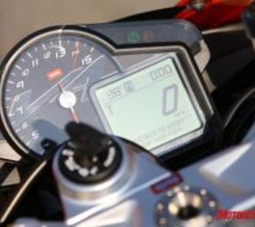2010 aprilia rsv4 factory review motorcycle com, The prominently located tach is easy to see even at crazy fast speeds The large LCD is full of data while an array of warning lights including a programmable shift light rounds out the compact but robust instruments