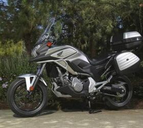 2012 honda nc700x review video motorcycle com, Fully accessorized the NC700X transforms into a different motorcycle The tall windscreen measures 5 5 inches higher and 3 1 inches wider than stock and makes a big difference in wind protection