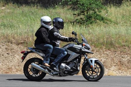 2012 honda nc700x review video motorcycle com, Thanks to the DCT bumping heads with your pillion at each shift is a thing of the past