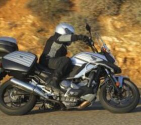 2012 honda nc700x review video motorcycle com, At a moderate pace the meager suspension is still able to hold up but go much faster and it starts to protest Ground clearance is never an issue even with the accessory centerstand