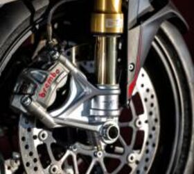 2013 mv agusta f4 and f4 rr review motorcycle com, Slowing the RR are dual 320mm discs clamped by Brembo s top of the line M50 calipers first seen and developed for the Ducati 1199 Panigale Note the steel braided brake line for optimum lever feel