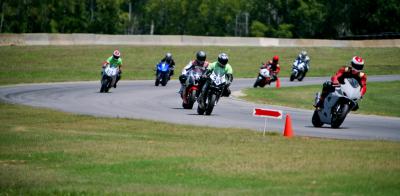 road racing series part 4, Photo by Holly Marcus When selecting a track school find one that has a good instructor in the green t shirts to student ratio