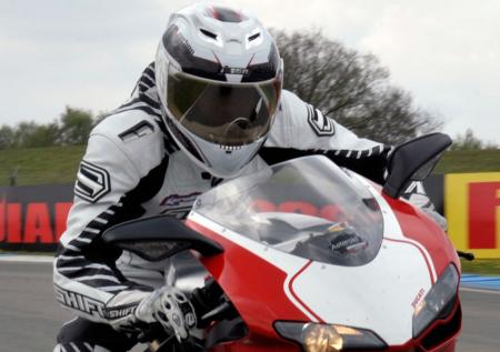 2010 icon airframe carbon lifeform helmet review, Icon s new top line lid looks at home even on a 25K Ducati 1198S Corse
