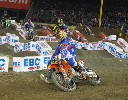 2013 ama supercross anaheim 1 race report, Ryan Dungey 5 was probably the fastest of the favored riders but got off to a mid pack start in the main Dungey set the pits a buzzing when he showed up with an air shock that KTM officials tried to keep really quiet After 20 laps Dungey finished third in the main