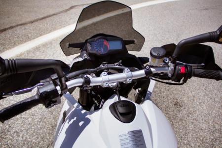 2012 ktm 990 sm t review motorcycle com, From the saddle the KTM s user interface is rather straightforward Switches on each handlebar are basic as is the gauge cluster The flyscreen does a decent job deflecting wind and mirrors are actually usable