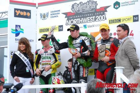 2010 north west 200 report, Seeley on the podium with second place finisher Stuart Easton left and John McGuinness right in third