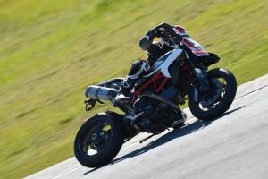 2013 ducati hypermotard 821 review motorcycle com, It takes considerable lean angle to touch a footpeg down but on a few occasions the sidestand would scrape while banked over in left turns