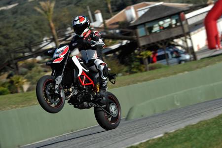 2013 ducati hypermotard 821 review motorcycle com, Gratuitous wheelie shot because well that s what you do on a Hypermotard