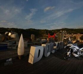 2013 ducati multistrada 1200 s touring review motorcycle com, Bilbao Spain made a nice backdrop for the 2013 Multistrada launch The wild Frank Gehry designed Guggenheim museum former home of the Art of the Motorcycle exhibition is visible on the left