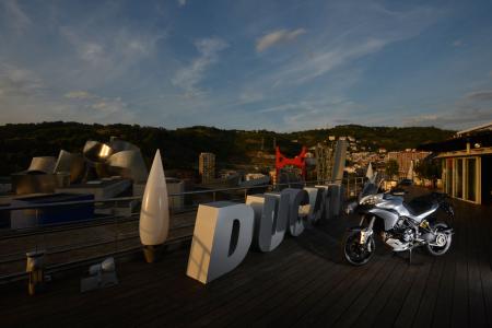 2013 ducati multistrada 1200 s touring review motorcycle com, Bilbao Spain made a nice backdrop for the 2013 Multistrada launch The wild Frank Gehry designed Guggenheim museum former home of the Art of the Motorcycle exhibition is visible on the left