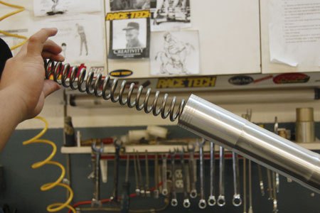 road racing series part 6, Race Tech replaces the OEM fork spring with one of its units with the appropriate rate to handle the weight of the rider and the machine Photo courtesy of Race Tech