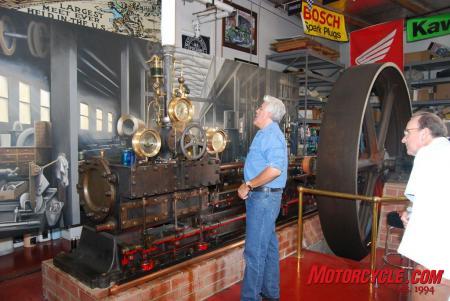 yamaha throws laguna seca motogp warm up party in jay leno s garage, Leno is a hands on type of guy he knows a lot about the vehicles and machines he owns Here he s inspecting a large and functioning steam engine once owned by Thomas Edison