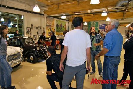 yamaha throws laguna seca motogp warm up party in jay leno s garage, Leno entertains some Italians attending the party