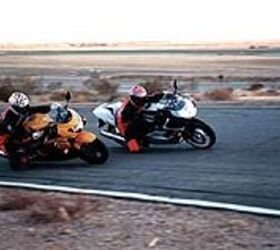 manufacturer 1999 600cc supersport shootout 15410, The GSX R on the track passing other bikes leaving them behind until it s out in front and ultimately