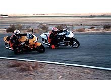 manufacturer 1999 600cc supersport shootout 15410, The GSX R on the track passing other bikes leaving them behind until it s out in front and ultimately