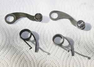 road racing series part 12, The Factory Pro Shift Kit right with its roller bearing shift arm and stronger spring compared to the OEM parts left