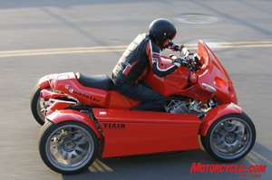 2008 gg quadster review motorcycle com, While the Quadster might not be a primary choice for a touring machine accommodations are spacious and luxurious The cylinders of the forward canted K1200 cylinders can be seen ahead of Duke s knee