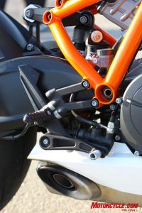 2010 literbike shootout aprilia rsv4 factory vs ducati 1198s vs ktm rc8r , The RC8R s footpegs and rear brake pedal peg as well as the shifter peg are just a couple examples of the way a rider can adjust the KTM to suit riding style or fit Note the eccentric on the upper rear of the shock linkage is used for ride height adjustments Even more impressive is how easily the shock is accessed